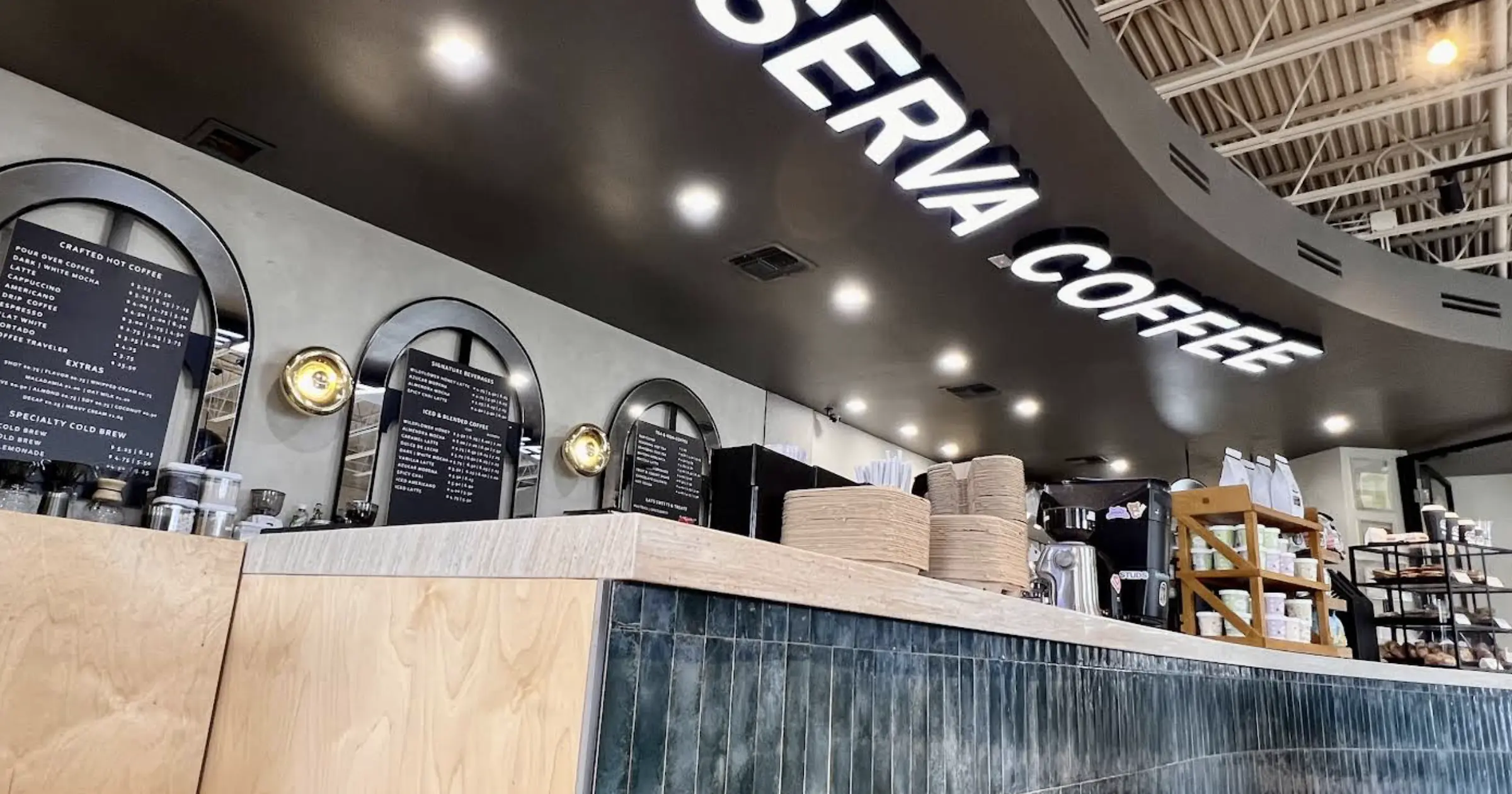 Interior of Reserva Coffee Roasters in McAllen, showcasing the cozy atmosphere and specialty coffee offerings.
